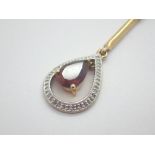 9ct gold pear cut garnet and diamond pendant on 9ct gold necklace