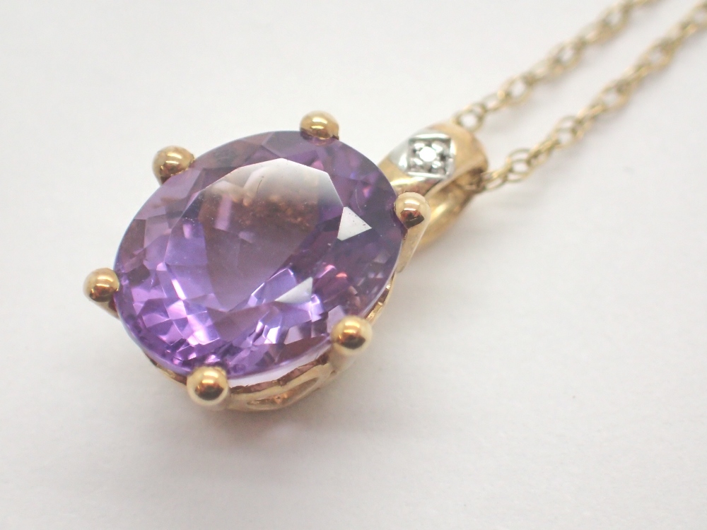 9ct gold oval amethyst and diamond pendant on 9ct gold necklace