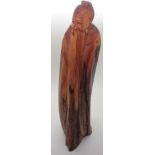 Carved wooden Chinese figurine signed to base H: 30 cm