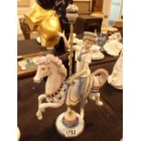 Lladro boy on carnival horse H: 30 cm CONDITION REPORT: No visible damage or losses.