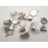 Fifteen mixed silver charms