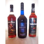 Two bottles of Captain Morgan rum and a bottle of Harveys Bristol cream