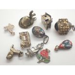 Ten assorted silver charms