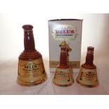 Decanter of Bells Scotch whisky 6 2/3 oz and two miniature Bells decanters all with contents