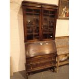 Oak bureau bookcase with leaded glass doors