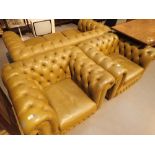 Green leather three piece Chesterfield lounge suite comprising three seater sofa and two armchairs