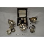 Silver including two sauce boats, small twin handle cup, coaster and ten various napkin rings, 620g