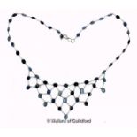 Sapphire fringe necklace, set with oval cut sapphires each separated by fine chains, mounted in