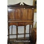 An Arts & Crafts mahogany side cabinet with central cupboard on separate stand, copper strapwork