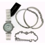 *Ladies' Anne Klein wristwatch, circular white dial with white stone set bezel, white strap,