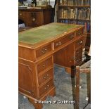 A reproduction yew wood pedestal desk with inset leatherette top, 121cm wide.