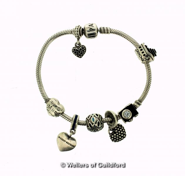 *Pandora bracelet with seven charms/spacers, length 19cm (Lot subject to VAT)