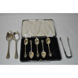 A set of five silver condiment spoons; a pair of white metal table spoons; a pair of silver sugar