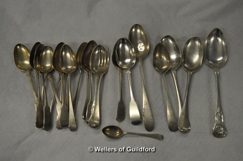 A quantity of silver spoons in various sizes, makers and dates, 900g.