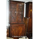 A 19th Century cupboard bookcase, the top section with two astragal glazed door over a single