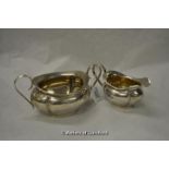 A silver twin handled sugar bowl and matching milk jug, Birmingham 1922, 375g.