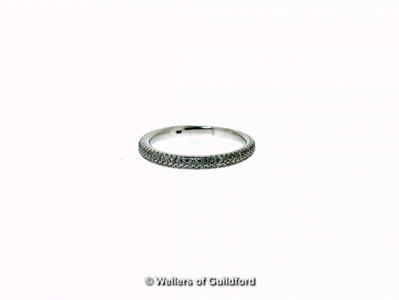 *Diamond half eternity ring, in white metal stamped as 18ct, ring size M (Lot subject to VAT)