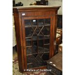 A late Georgian mahogany hanging corner cabinet with astragal glazed door, 116cm high.