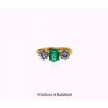 Emerald and diamond three stone ring, central rectangular step cut emerald, weighing an estimated