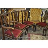 A set of six George III style dining chairs including two carvers, with pierced vase shaped backs,