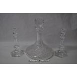 A pair of Baccarat glass candlesticks; a Waterford crystal ship's decanter.