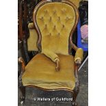 A Victorian spoonback armchair.