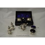 A silver cruet se tcomprising pair of pepperettes, pair of salts and a mustard pot with three odd