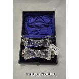 A pair of cut glass knife rests with silver mounts, cased.