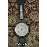 An oak banjo barometer/thermometer.