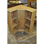 An early 20th Century oak corner bookcase.