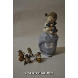 Nao figure of a girl holding a puppy; a four piece comical cat band.(5)