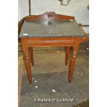 A late Victorian mahogany washstand with black marble top.