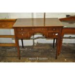 A George IV mahogany side table with crossbanded top over five small drawers on tapering square