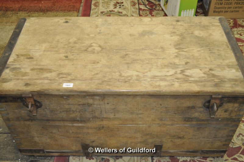 An early 19th pine trunk with metal bindings and handles, 52 x 52 x 105cm