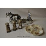 A porcelain figure of a man ploughing with two horses; three hardstone figures of Chinese people;