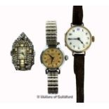 Ladies' silver cased wristwatch, circular white dial with Arabic numerals, on a brown leather strap,