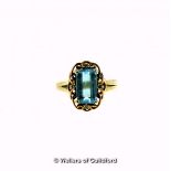 *Blue topaz and diamond dress ring, emerald cut blue topaz set within a scroll border, with four