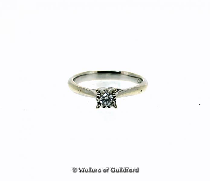 Single stone diamond ring, round brilliant cut diamond weighing an estimated 0.10ct, illusion set in