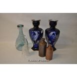 A pair of hexagonal blue vases; wine carafe and stoneware bottles.