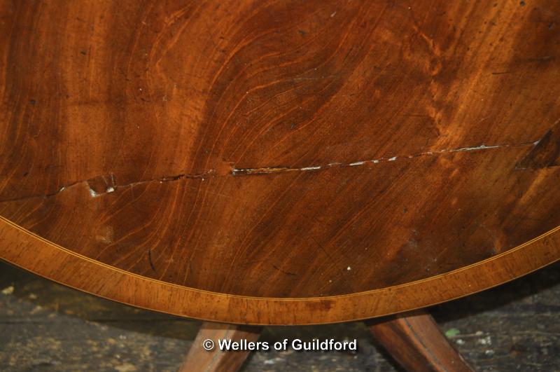 A George IV crossbanded oval mahogany tilt top breakfast table on tripod support, 120 x 91cm. - Image 3 of 4