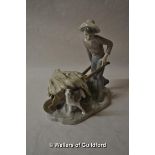 Lladro figure of a boy with dog and wheelbarrow of straw, 22cm tall.