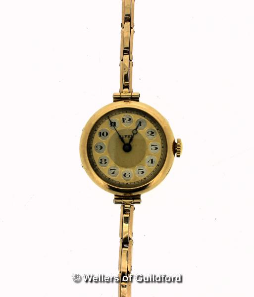 Ladies' vintage Buren bracelet watch in yellow metal stamped 9ct, circular champagne coloured dial