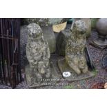 *PAIR OF COMPOSITION STONE STATUES FEATURING KNEELING GIRLS HOLDING RABBITS, 700 HIGH