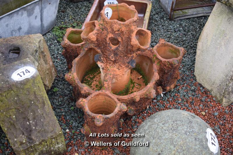 *TERRACOTTA MULTI SECTION PLANTER IN THE FORM OF A TREE STUMP