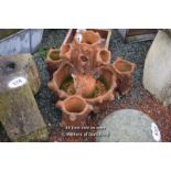 *TERRACOTTA MULTI SECTION PLANTER IN THE FORM OF A TREE STUMP