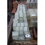 *APPROX ONE HUNDRED SQUARE GLASS BRICKS, 140 X 140