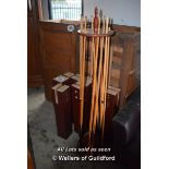 *EIGHT SNOOKER TABLE LEGS, CUE STAND WITH CUES, TWO BOXES OF BALLS AND A WOODEN AND BRASS SLIDER