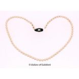 Mikimoto single row pearl necklace, length 36cm, a/f broken at clasp, in original box