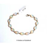 Opal line bracelet, thirteen oval cabochon opals rubover set in 9ct yellow gold, length 18cm