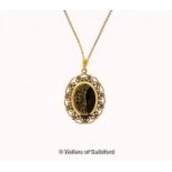 9ct gold oval locket, on a yellow metal fine chain stamped 9ct, length 61cm, gross weight 8.8 grams